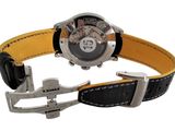 a watch that is sitting on a black and yellow strap