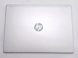 a white laptop with a hp logo on the screen