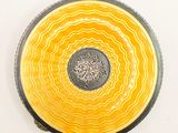 a yellow and black bowl with a tree on it
