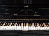 a black piano that is sitting in the room