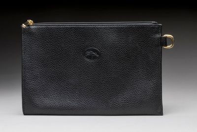 a black leather purse with a gold clasp