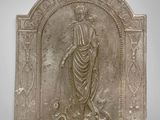 an image of a stone plaque with a woman holding a bird
