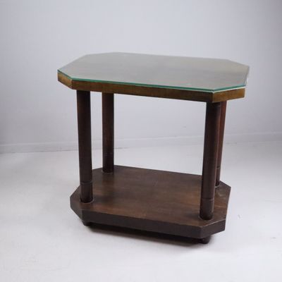 a close up of a table with a glass top on a white surface
