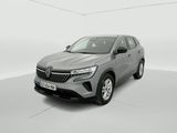 une voiture grise dans une pièce blanche au sol blanc