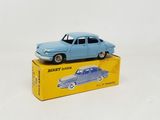 a blue toy car sitting on top of a yellow box