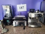 many different types of kitchen appliances on the counter