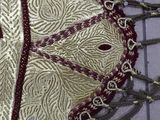 a close up of a pair of scissors and a piece of cloth