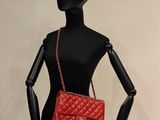 chanel red quilted lambskin flap bag on mannequin base