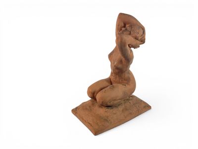an image of a statue of a woman sitting on top of a wooden block