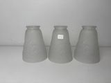 three vases that are sitting on a shelf