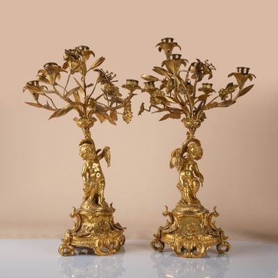 pair of antique brass candelabs with flowers and birds