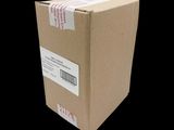 a cardboard box with a sticker on it on a black background
