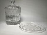 a glass jar with a lid sitting on a table
