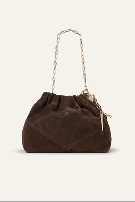 a brown sued bag with chain handles and a chain handle