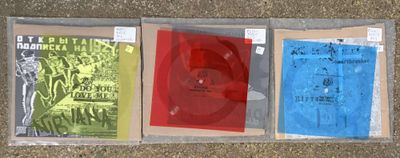 three cds in a plastic case on the floor
