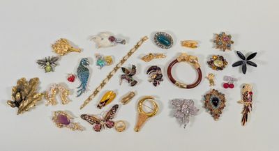 many different types of jewelry on a white surface