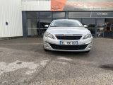 a picture of a silver car parked in front of a building