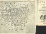 an old map of the city of paris with a map of the city