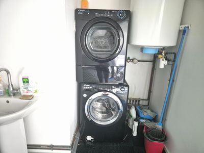 a washer and dryer in a small room