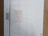 une photo d'une plaque de cuisson sur laquelle figure l'image d'un homme