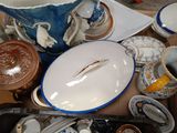 a table with a lot of dishes and cups on it