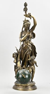 bronze statue of a woman holding a sword and a globe on a stand
