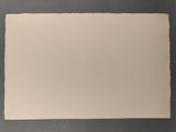 an old photo of a piece of paper on a table