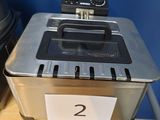 a toaster that is sitting on a table with a number on it