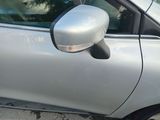 a silver car that is parked on the side of the road