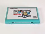 a nintendo game console sitting on a white surface