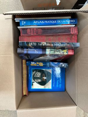 a box full of books that are sitting on the floor