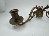 a candle holder and a candle holder on a table