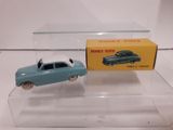 a small toy car and a box on a table