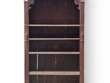 an old wooden bookcase with two shelves and two doors