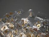 a pile of pins and magnets in a plastic bag