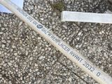 a broken toothbrush sitting on the ground next to a broken toothbrush
