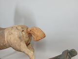 a wooden rocking horse that is sitting on a table