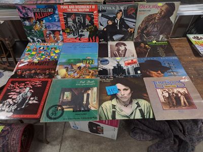 a lot of records on a table in a room