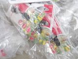 a bunch of candy wrapped in plastic bags on the floor
