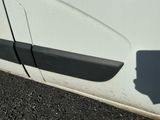 a close up of a car door handle with a shadow on the side of it