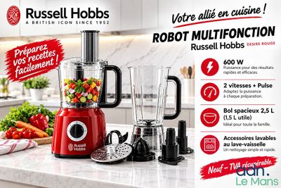 un mixeur rouge posé sur un plan de travail, à côté d'un tas de légumes