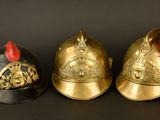 three helmets that are sitting next to each other on a table