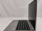 an open laptop computer sitting on top of a white surface