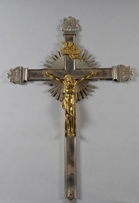 silver and gold crucifix with jesus on it on a white background