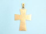 gold plated cross pendant on a blue background