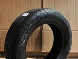 tires are stacked on a cardboard box in front of a cardboard box