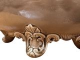 an image of a bronze pot with a lion head on it