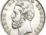 Gros plan sur une pièce de monnaie portant le visage d'un homme