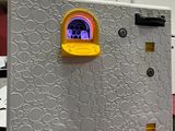 a refrigerator that has a picture of a dog in the window