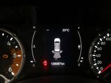 the dashboard of a car with the lights on and a car ' s engine light on